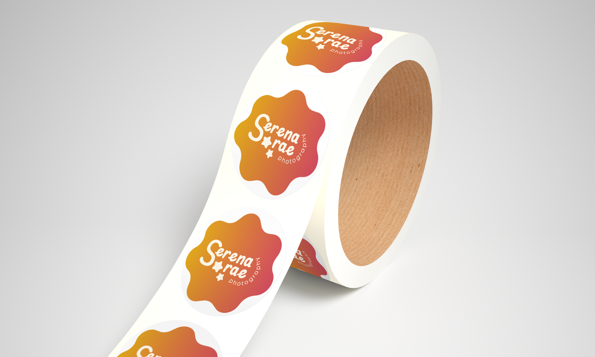 A logo designed for Serena Rae Photography mocked up as stickers.