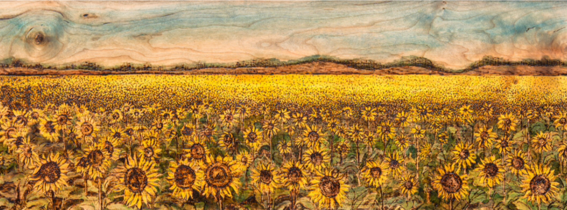 Bright Land of Ours. Field of Kansas Sunflowers. Woodburning and ink in handmade walnut frame. 13.25"x28.5".

Original: Sold I Prints: Available