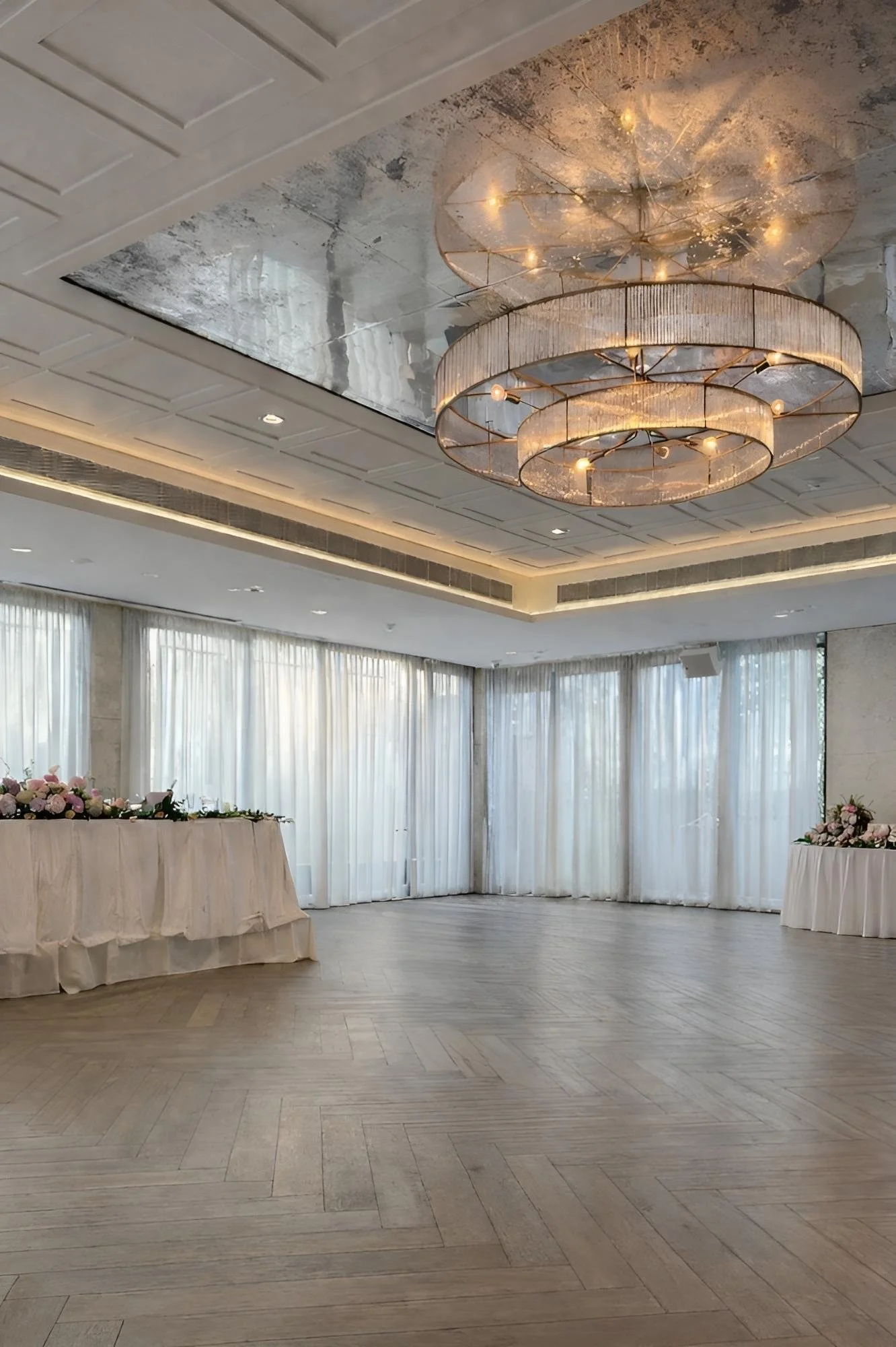 Light filled Sydney wedding reception venue with cohesive modern romantic styling and floral arrangements 