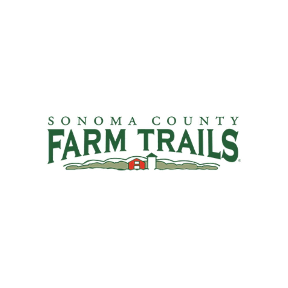 Logo for Sonoma County Farm Trails featuring green text and a farm landscape with a red barn and silo.