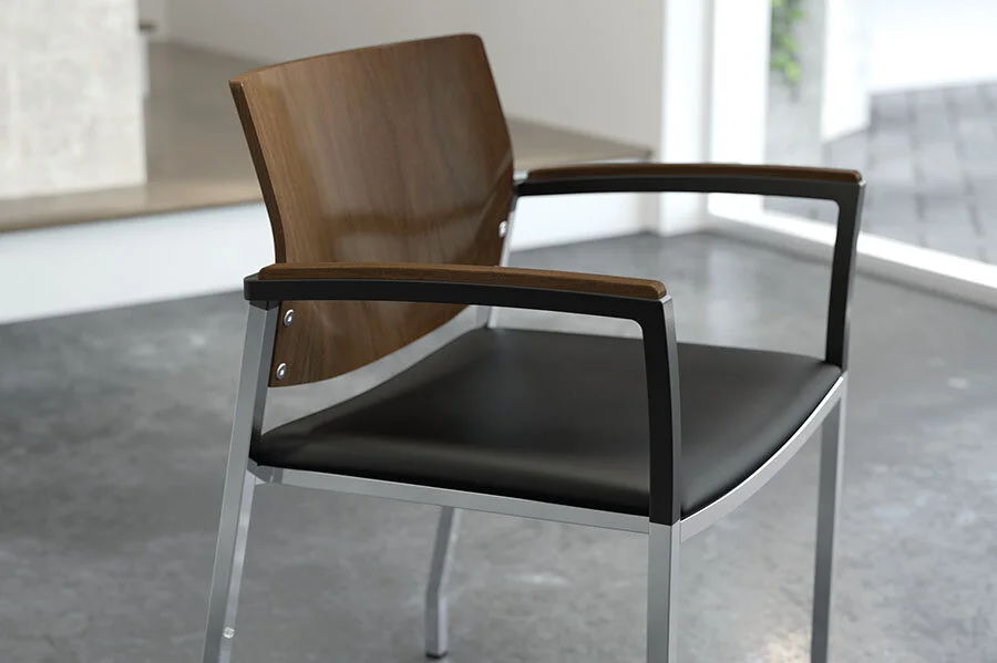 A modern chair with a wooden backrest, black seat, and metal frame near a window in a bright room.