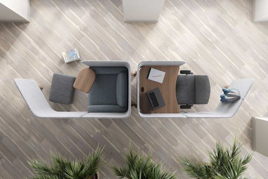 Overhead view of two connected office pods with gray chairs and desks, separated by a partition, on light wood flooring with plants at the bottom.