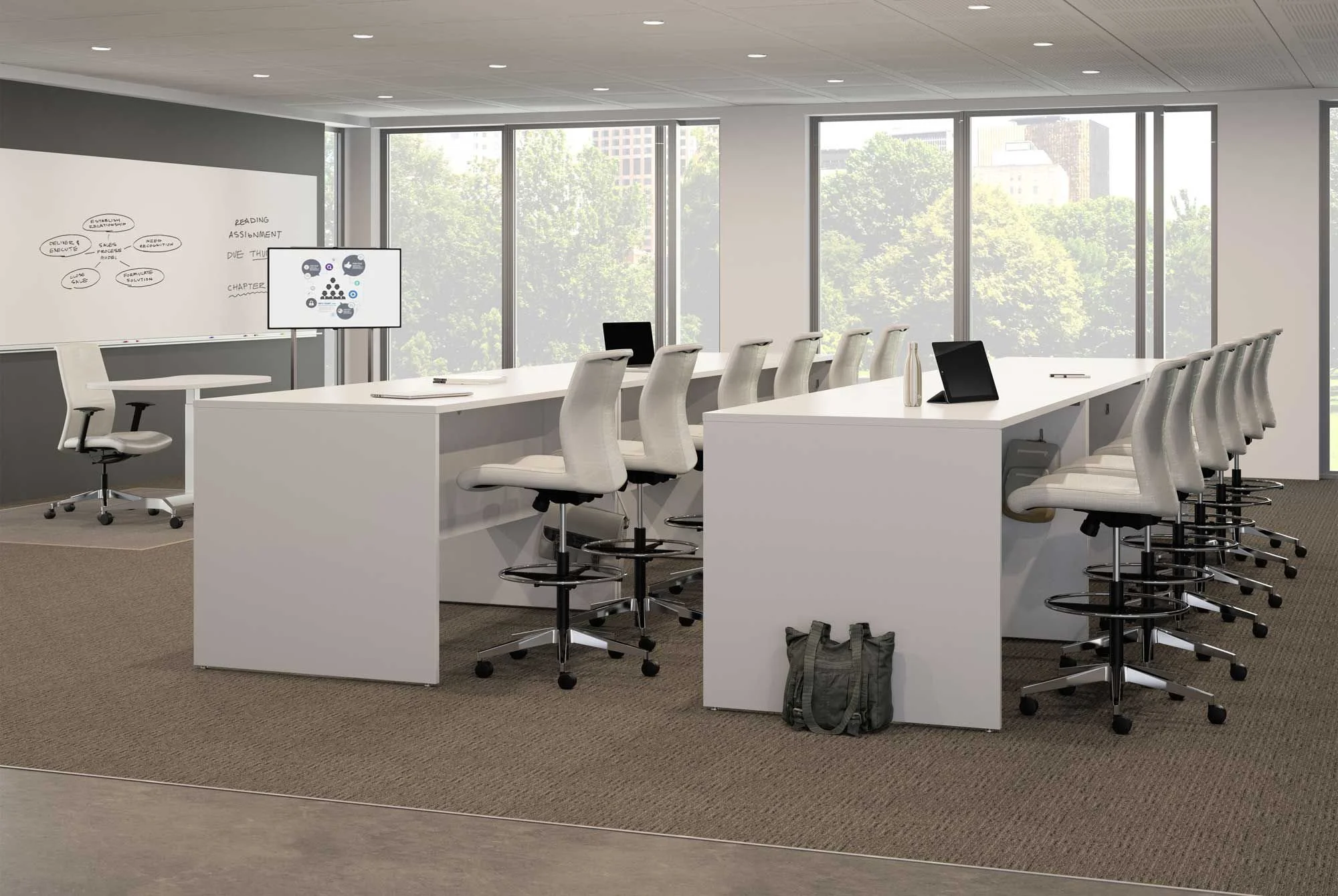 Modern conference room with white tables, white swivel chairs, large windows, a whiteboard with handwritten notes, and a digital display screen.