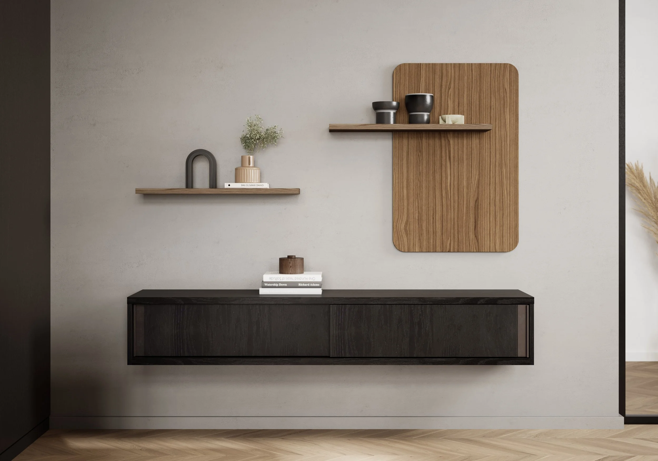 Modern interior with a floating black cabinet and two wooden shelves mounted on a light-colored wall, decorated with vases, books, and plants.