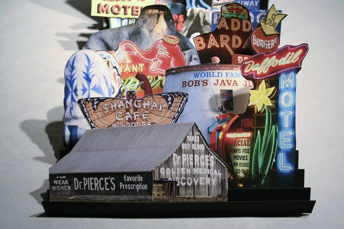 A pop-up book featuring Washington state neon signs.