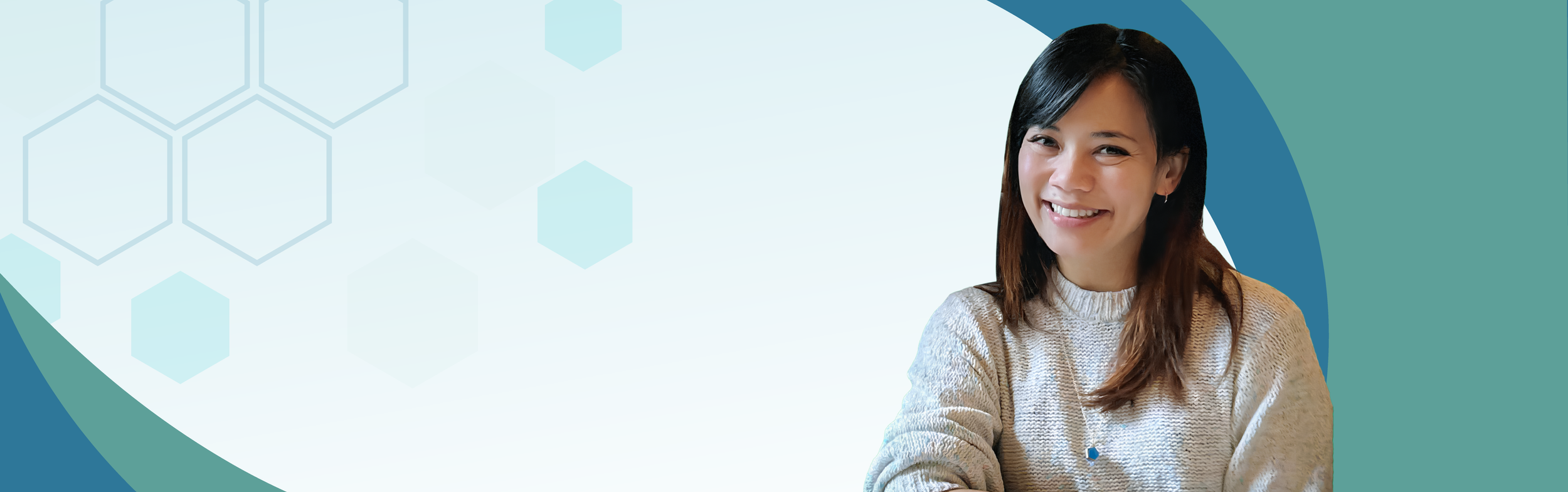 A smiling woman with shoulder-length dark hair wearing a beige sweater, sitting against a light blue background with hexagonal patterns.