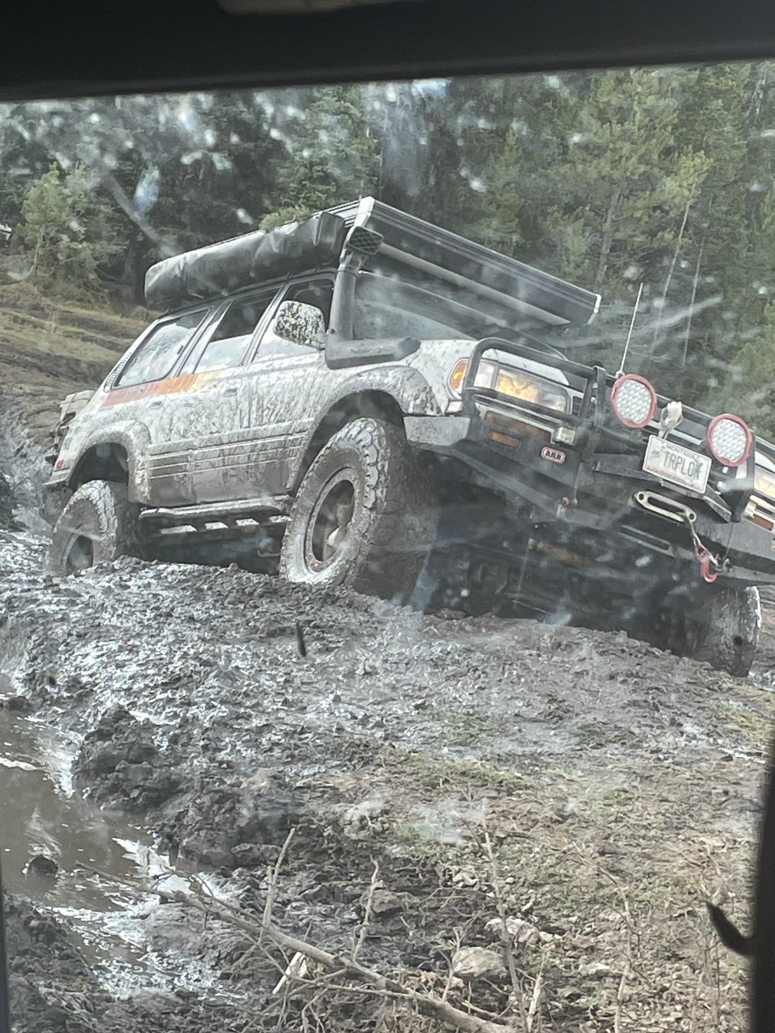 Silver SUV climbing a rocky trail at Whitetail Reservoir