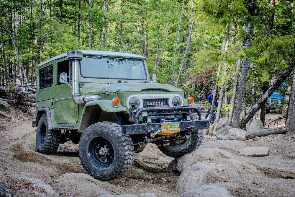 Green FJ40 on a rocky trail
