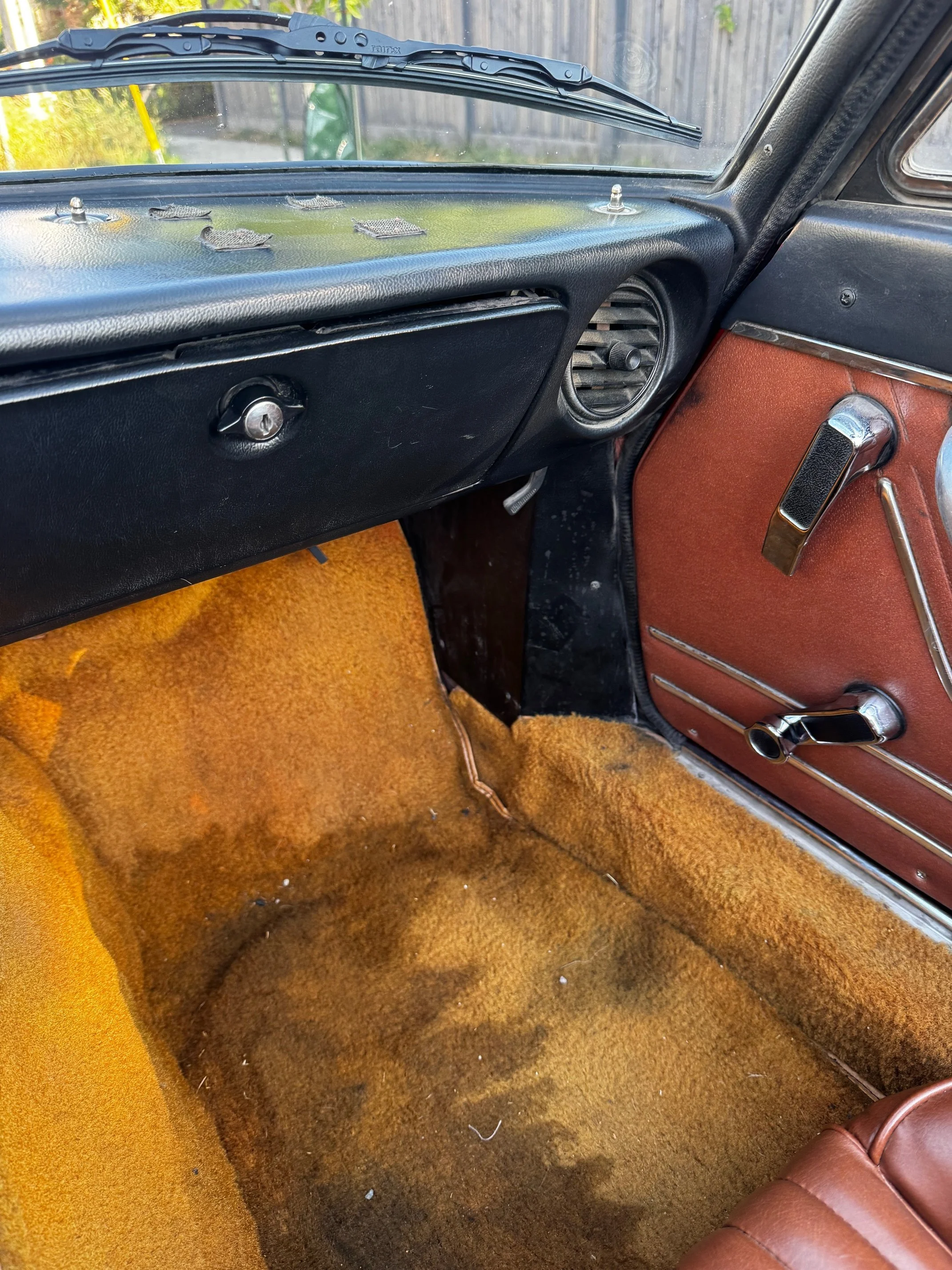 Tan interior of a red 1977 Alfa Romeo Spider