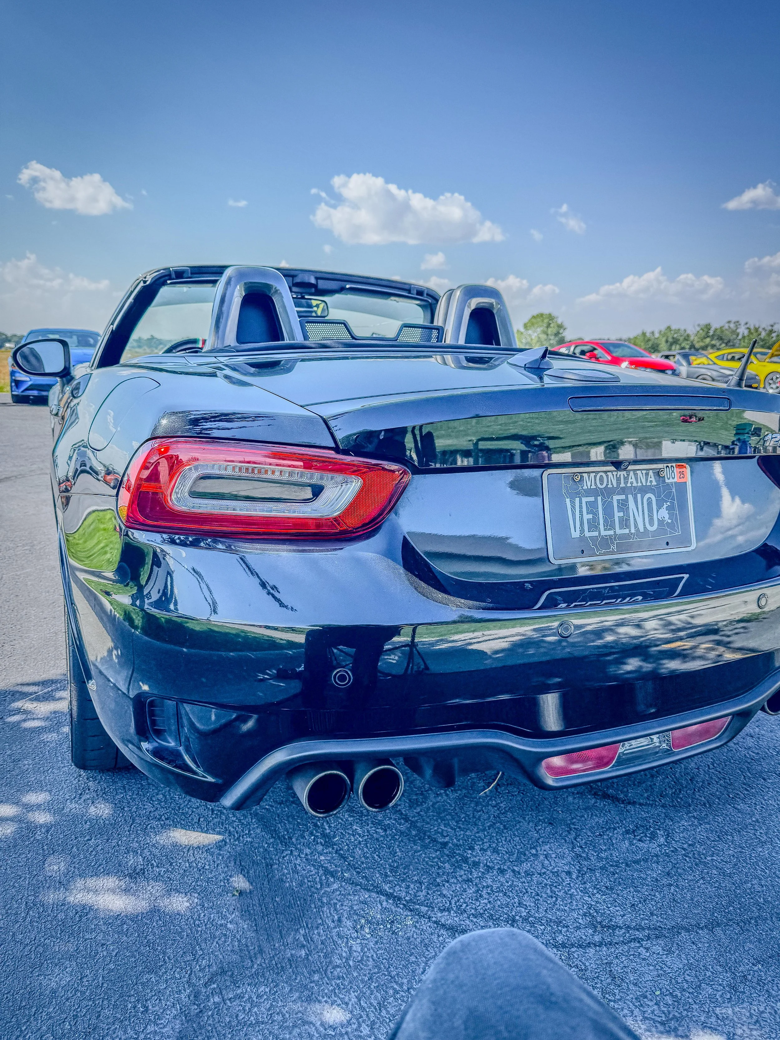 Black Fiat 124 Spider Abarth, rear view