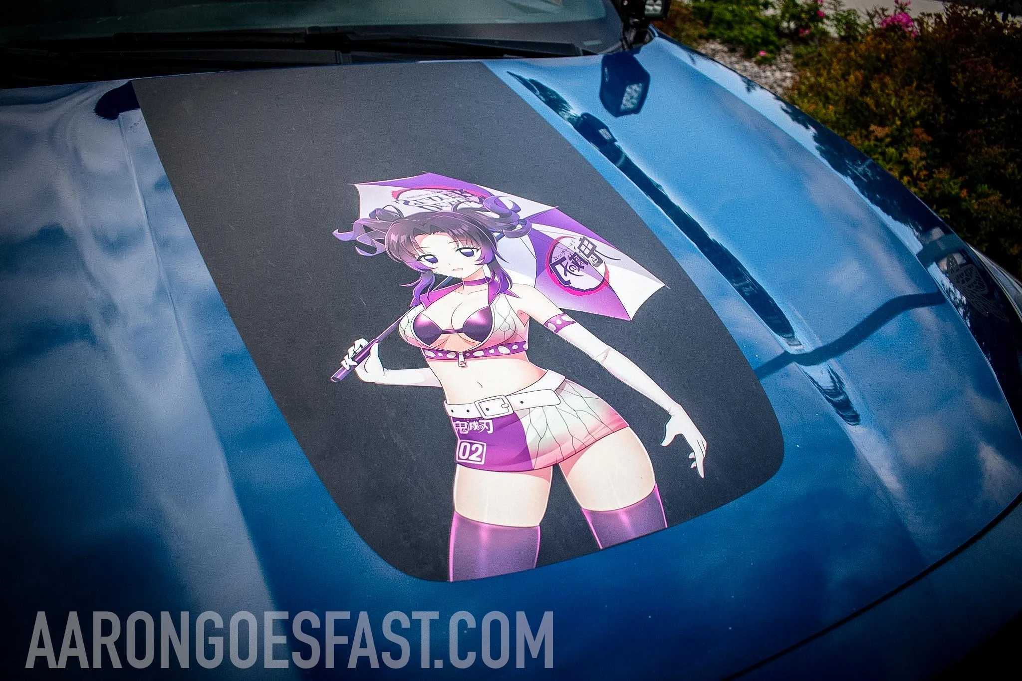Anime character decal on a blue Subaru hood at Ressler Cars & Coffee
