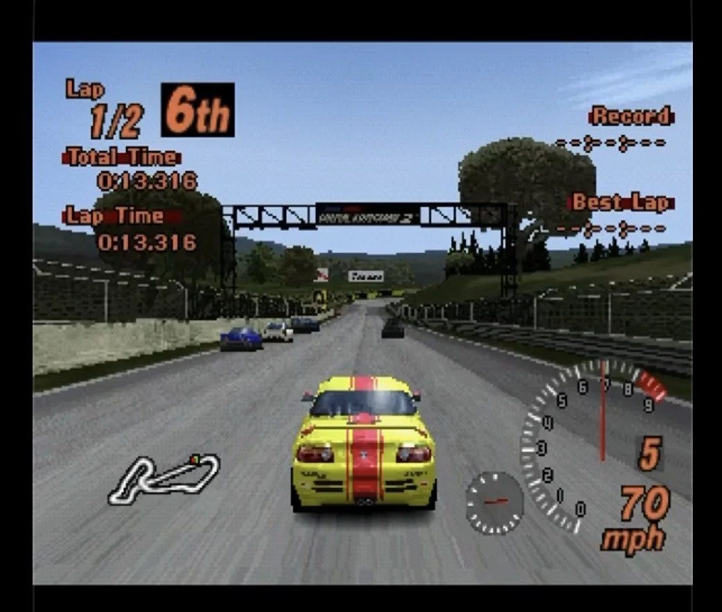 Yellow Honda Beat race car with red stripes in sixth place during a Gran Turismo 2 race