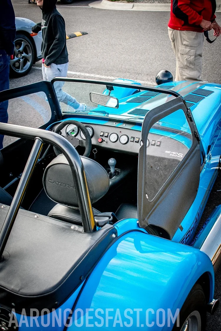 Interior of the Caterham Seven 360 showing the exposed roll bar and Seven S 360 badge