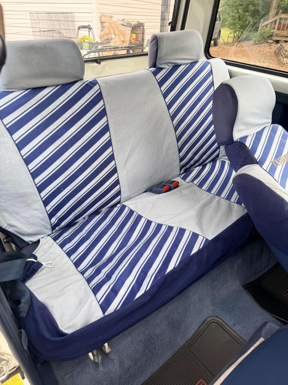 Blue and white diagonal-striped rear bench seat in the 1984 Honda City Turbo II