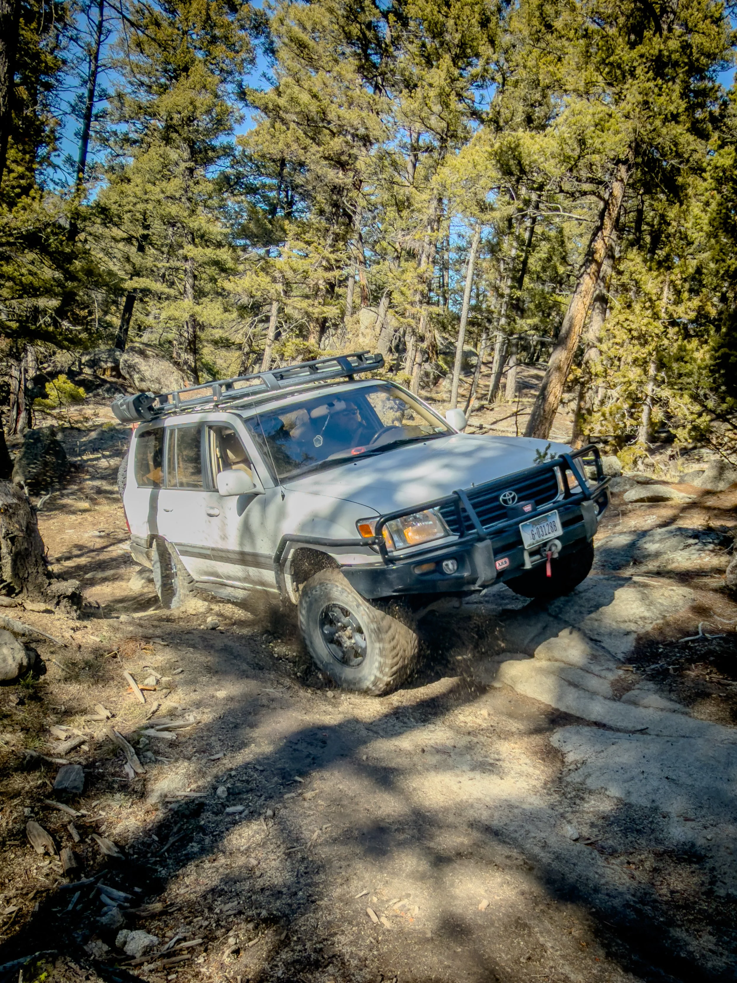 Silver SUV on a rocky trail on a winter Pipestone trail run