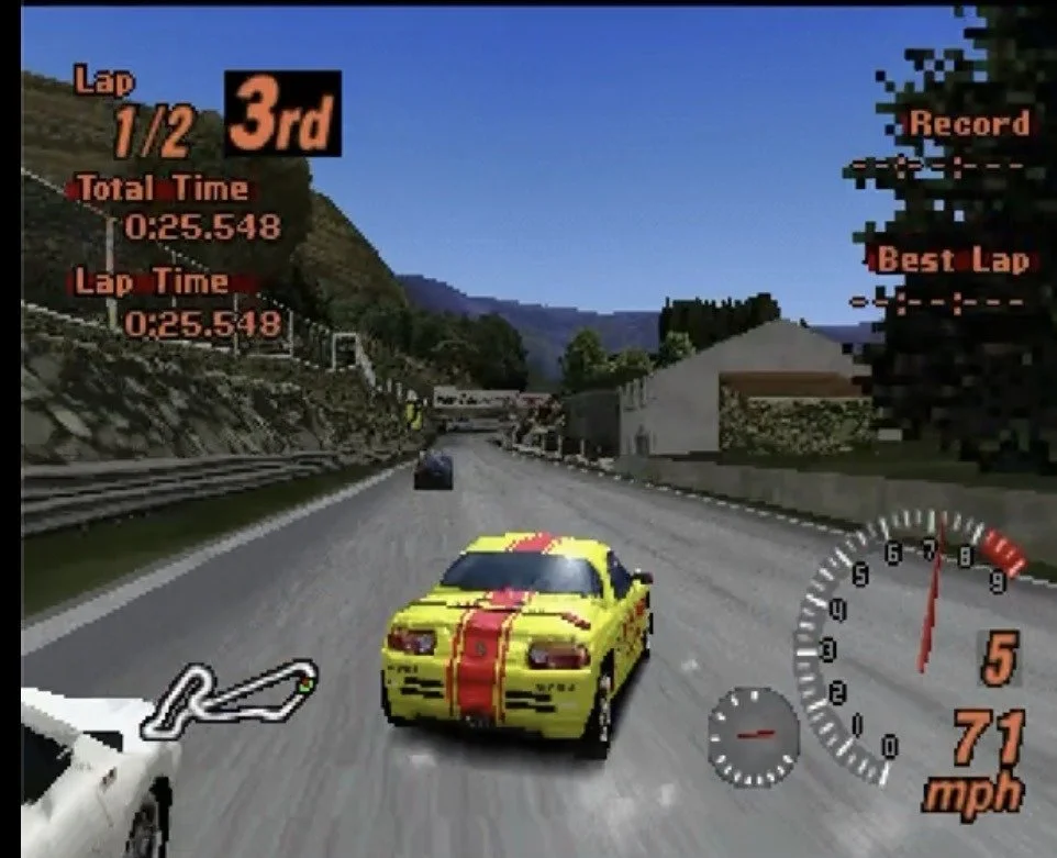 Yellow Honda Beat race car with red stripes in third place during a Gran Turismo 2 race