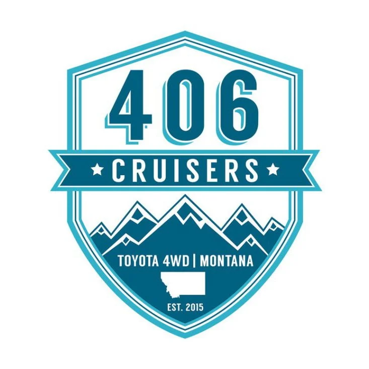 A blue and white badge emblem for 406 Cruisers featuring mountains, a state of Montana outline, and text for Toyota 4WD Montana established in 2015.