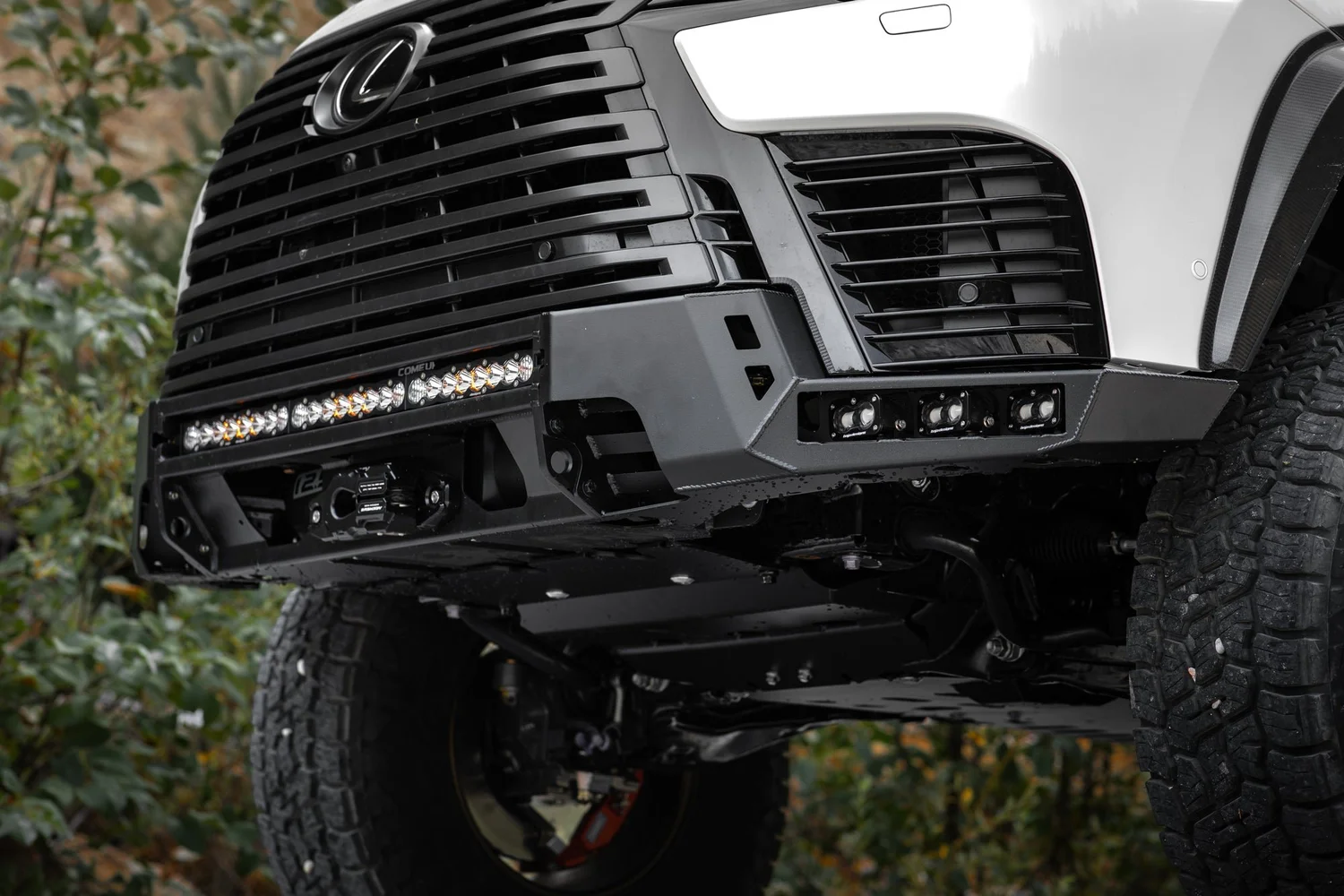 Dissent Off-Road low-profile front winch bumper with Baja Designs lights on the LX 700h