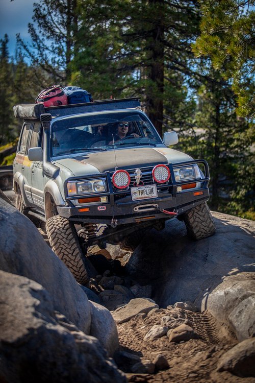 Aaron's Lexus LX450 climbing through rocks on the Rubicon Trail