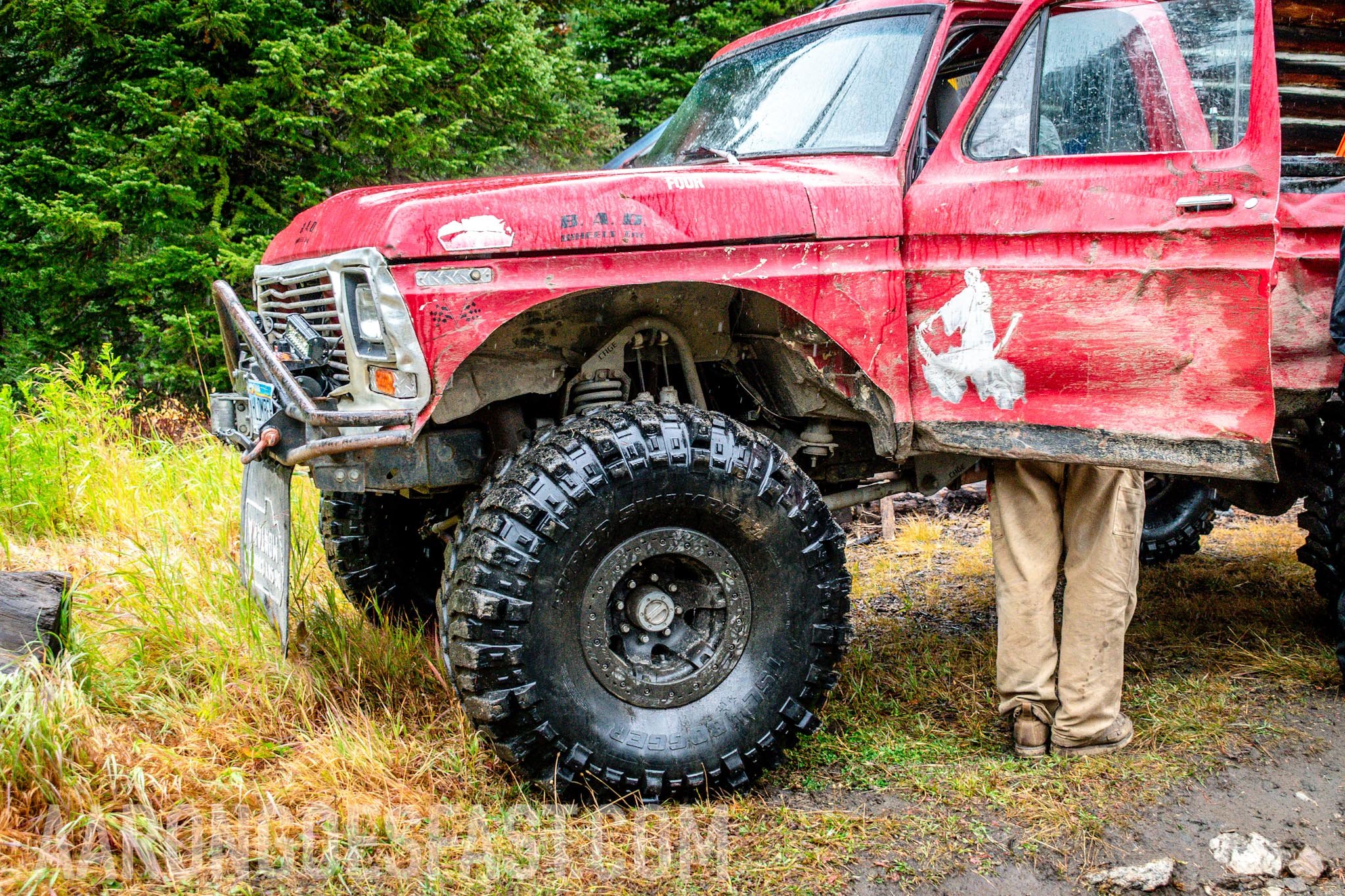 Red first-gen Toyota 4Runner on large mud tires on the McElvy Lake trail in the Tobacco Roots