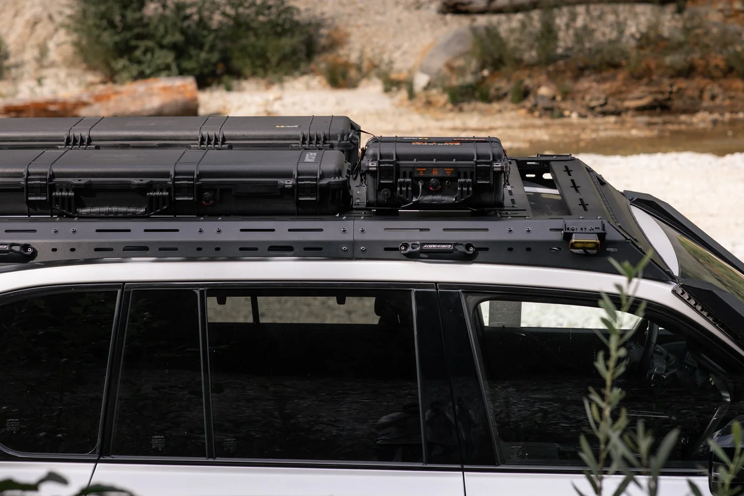 Dissent Off-Road aluminum roof rack with Pelican cases on the Lexus LX 700h