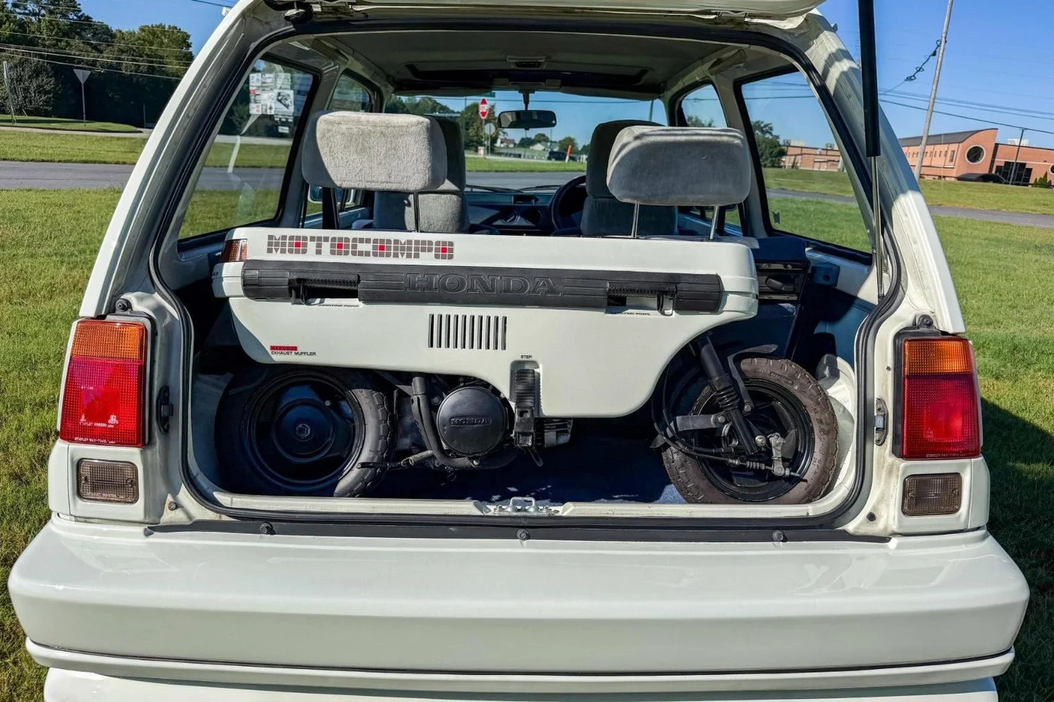 Honda Motocompo folded and loaded into the rear hatch of the 1984 Honda City Turbo II