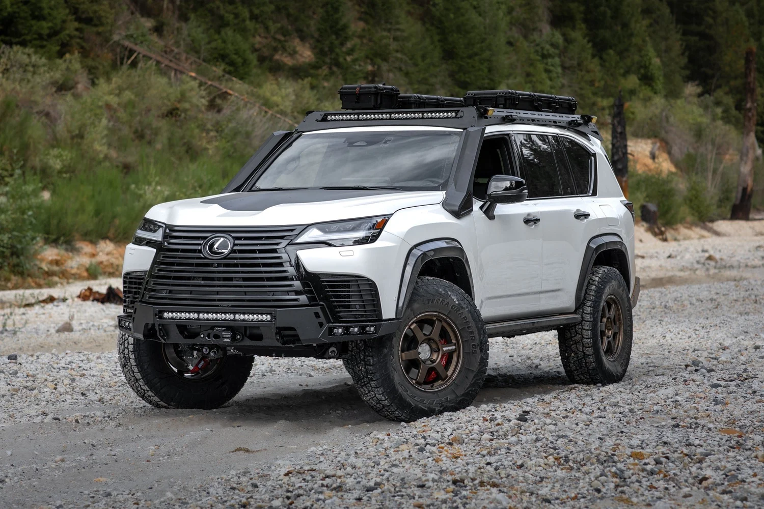 White Lexus LX 700h Overtrail built by Dissent Off-Road on 74 Weld portal axles, Volk TE37 wheels and 37-inch Nitto tires
