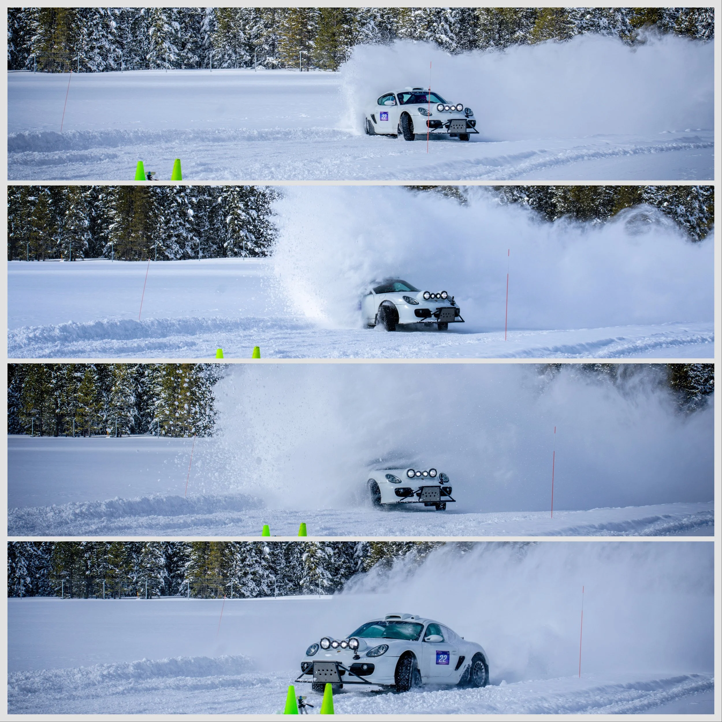 A white sports car participating in a snow autocross event, kicking up snow as it speeds around slalom cones on a snowy field with a forested background.