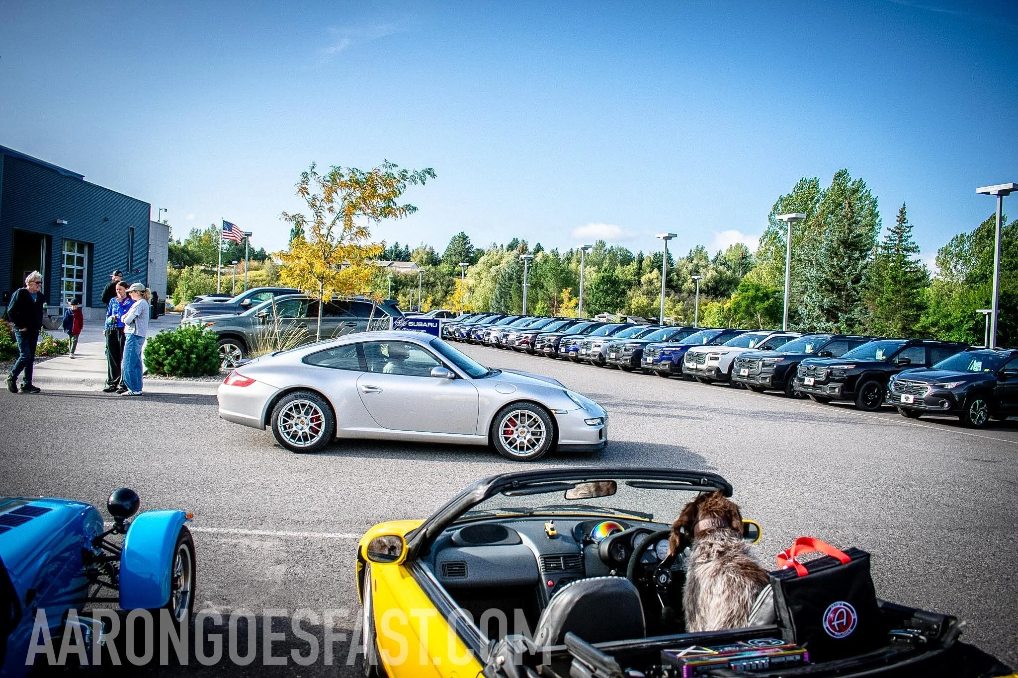 Silver Porsche 911 behind a yellow Honda Beat at Ressler Cars & Coffee