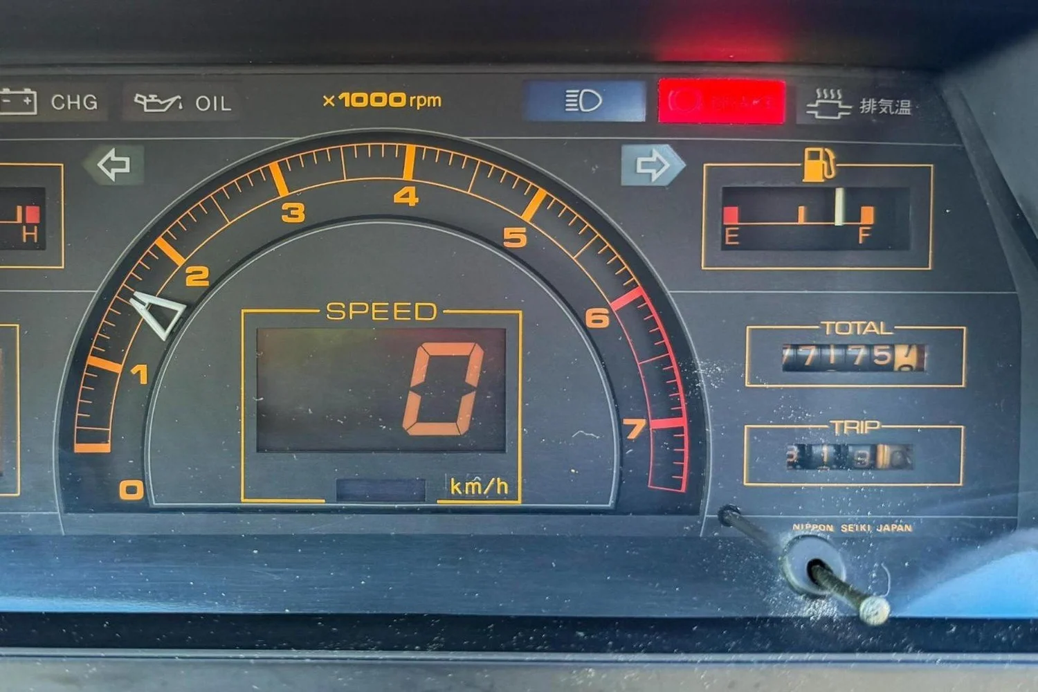 Orange analog tachometer and digital speedometer in the 1984 Honda City Turbo II
