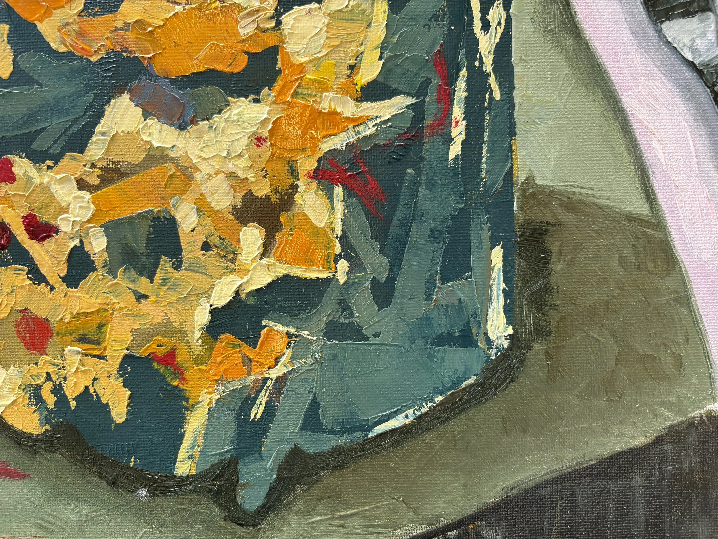 Close-up of an abstract oil painting of a cake with orange, blue, and beige geometric shapes and a red flowers on a dark textured background, by Anna Ford