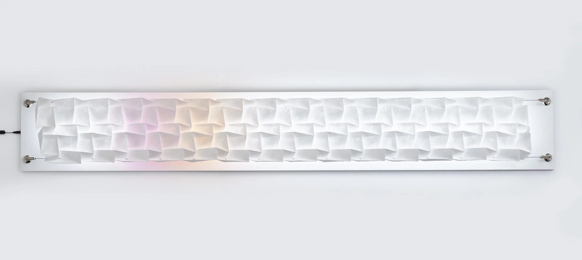 Tesselation Light No.2 – 2018 – folded Tyvek light with pink, orange colour gel films, led light, on wooden board, 100 x 35 x 10cm