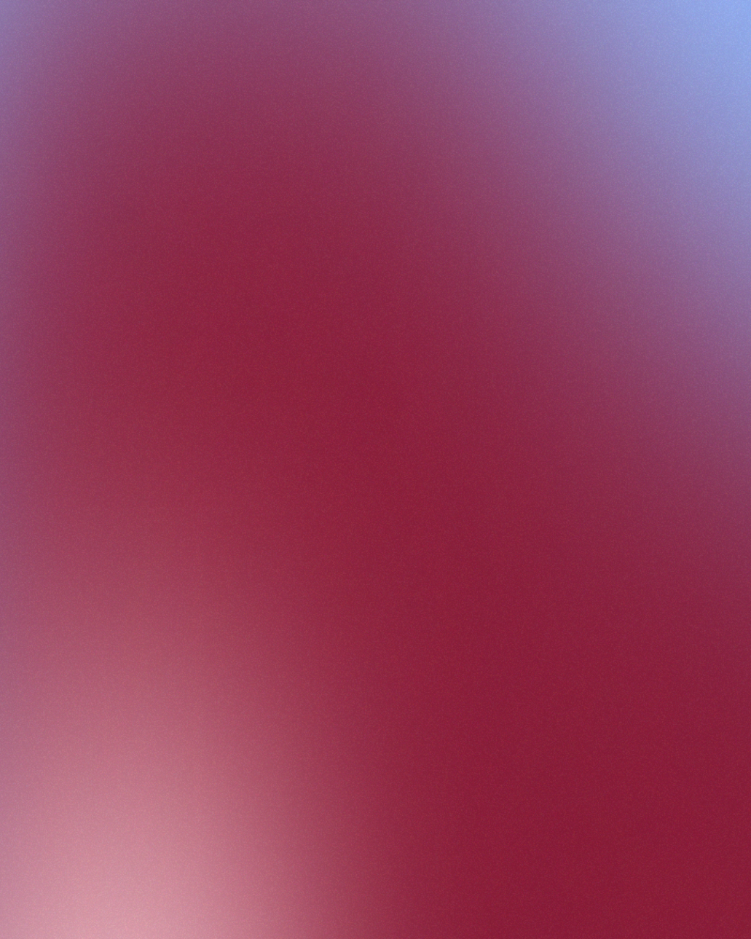 Une image floue avec des dégradés de couleurs roses, violettes et bleues.