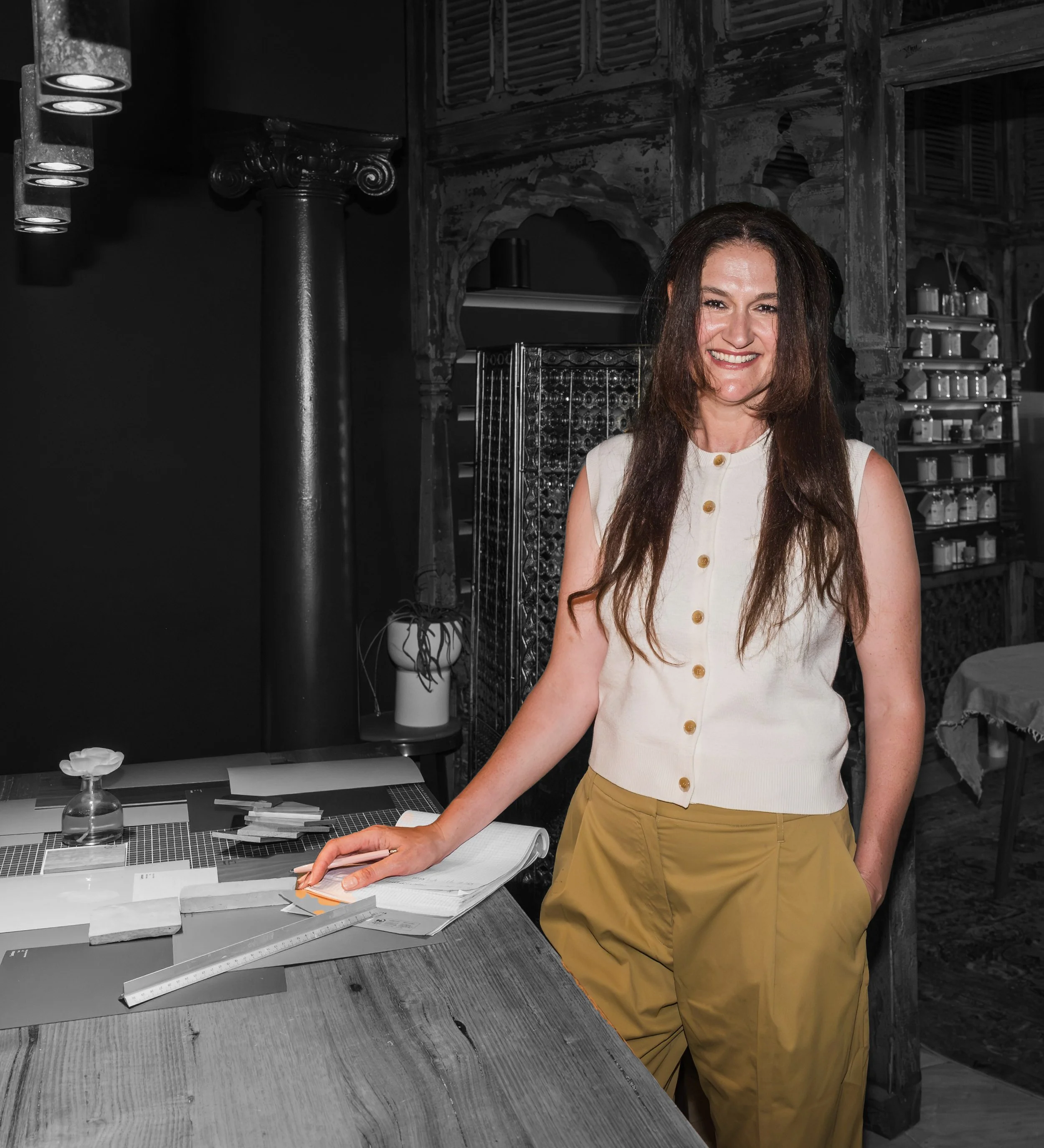 Virginia Polendakis, founder of ColourColour, photographed in her studio with a 150-year-old Indian temple, reflecting her design philosophy of light, harmony, and colour.
