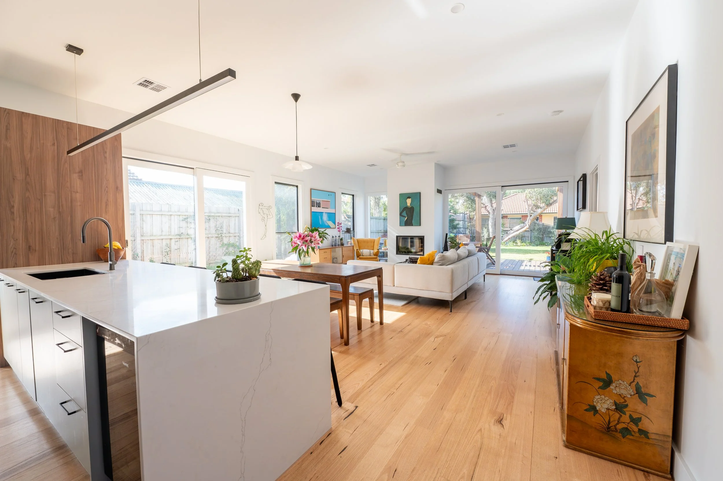 Oak Street kitchen redesigned to open into dining, living, and outdoor areas, featuring custom joinery, maximised storage, and seamless flow for family living and entertaining