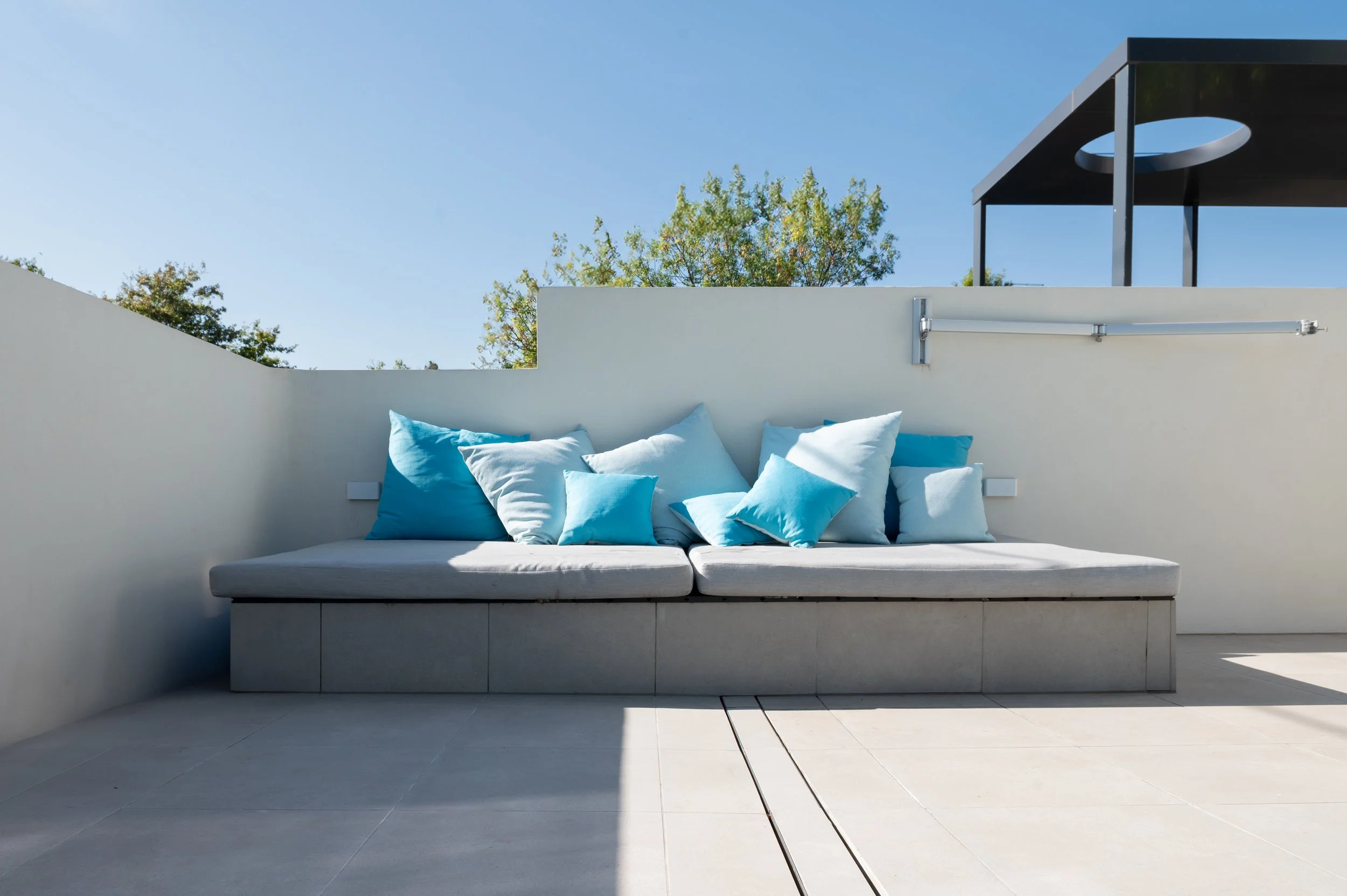 Close-up of the concrete frame and in-situ pour for the custom lift-up pool seat and underground pool equipment in the Brighton backyard.