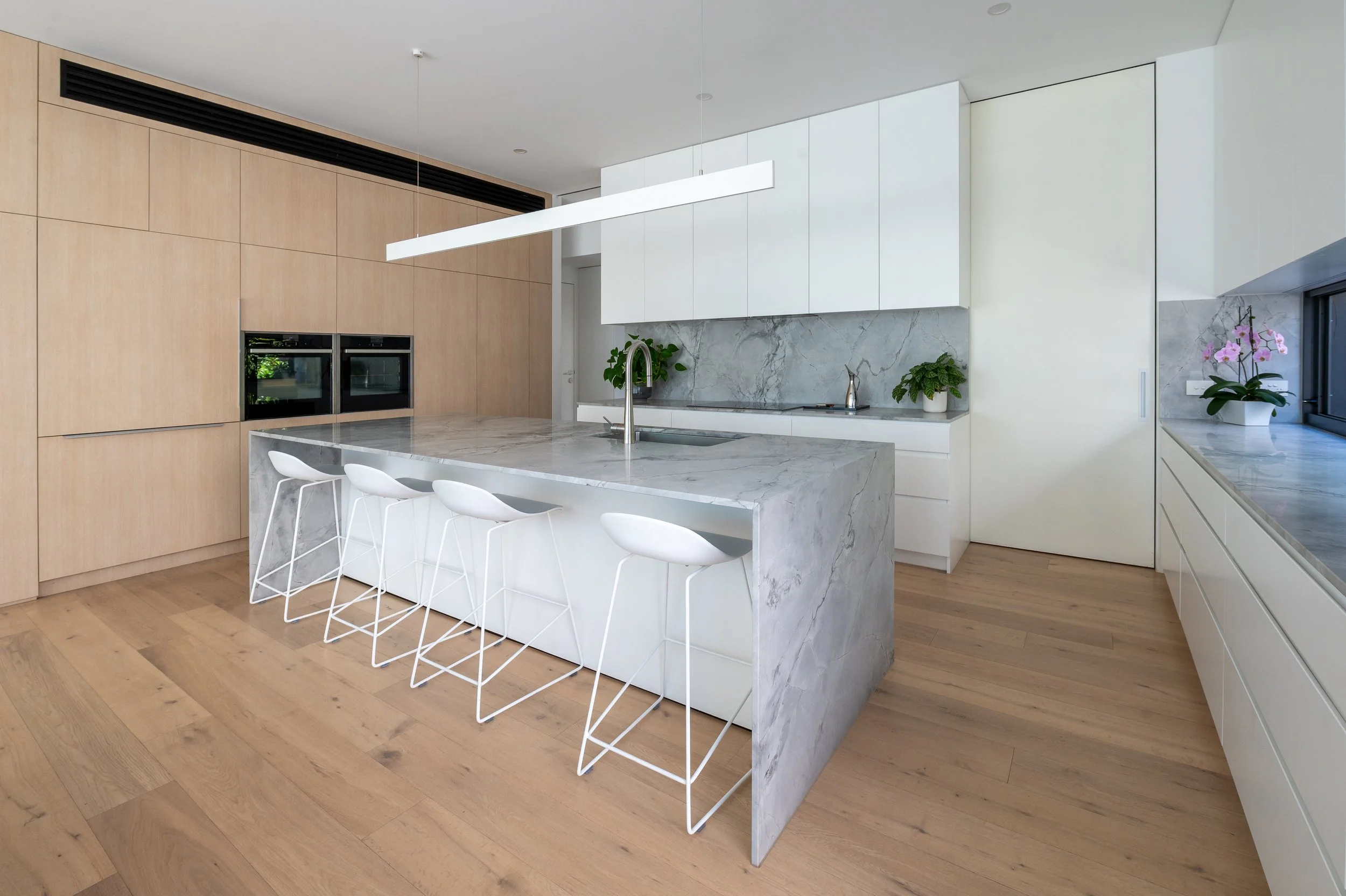 Brighton new-build kitchen showing custom joinery drawings for the cabinet maker and Dolomite Super White stone benchtops, highlighting material selection and design detail.