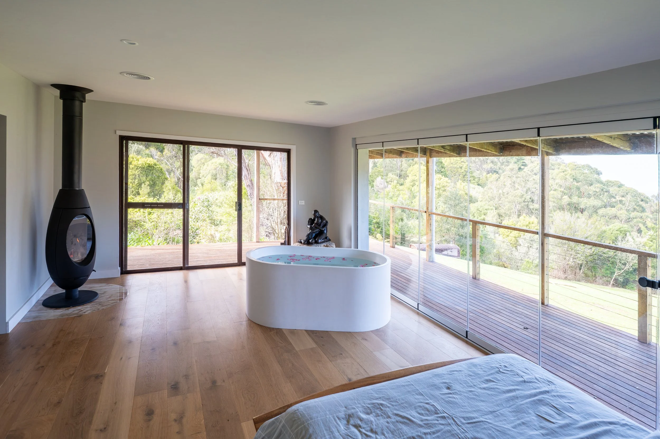 Melbourne country home bedroom redesigned to open towards valley and water views, with improved light, spaciousness, and flow