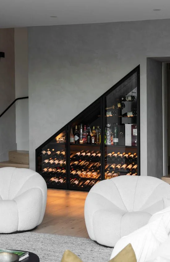 Custom under-stairs storage in Armadale home, integrating concealed joinery to maximise storage without disrupting circulation.