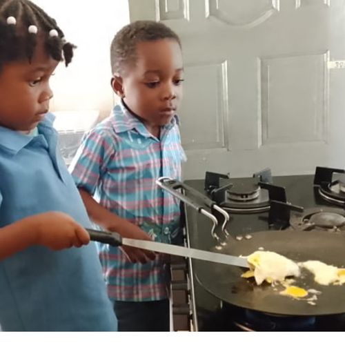 Toddler child practising practical life skills at House of Montessori Preschool