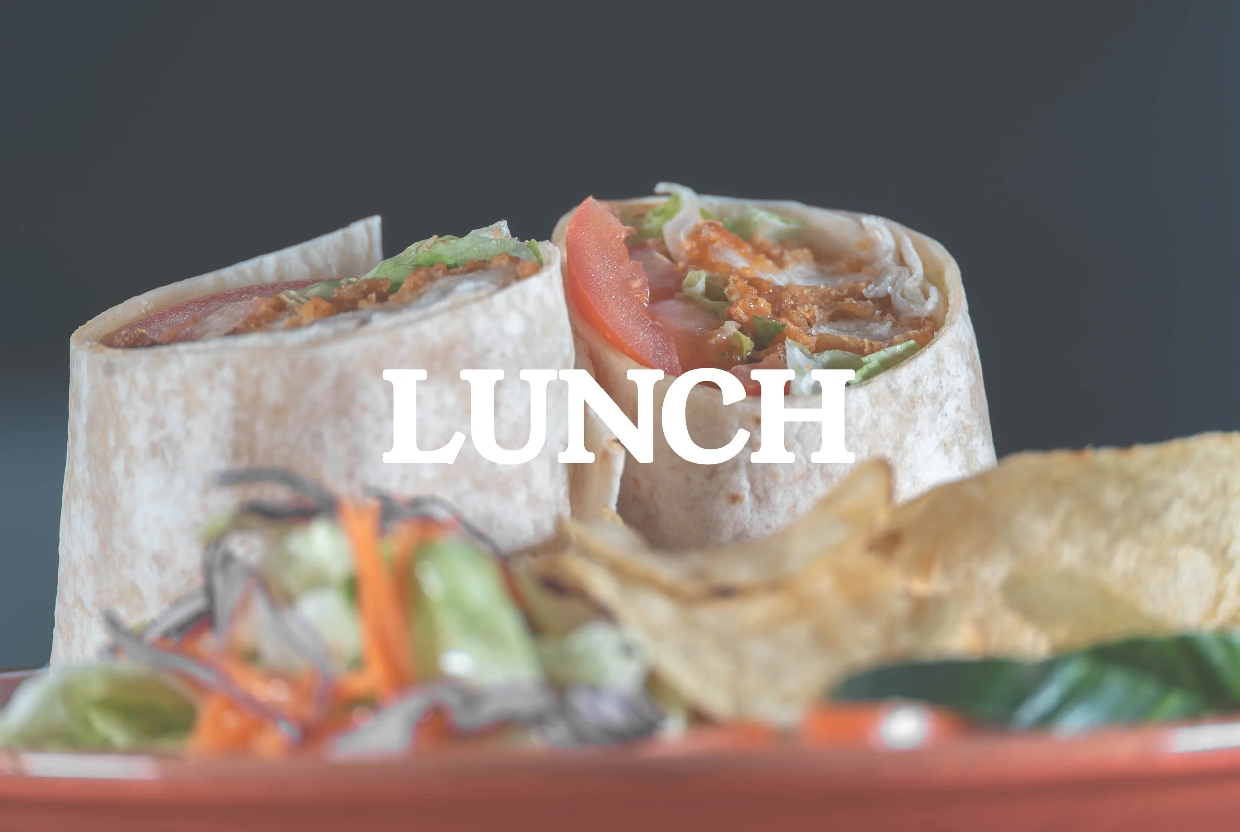 Two wraps filled with vegetables and protein, accompanied by a side salad and a potato chip, with the word 'LUNCH' overlaid.