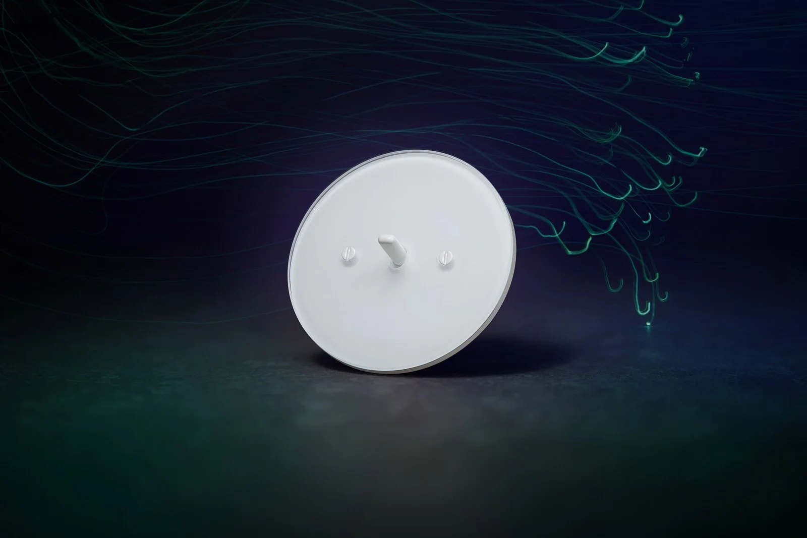 A white smoke detector mounted on a dark background with glowing lines.