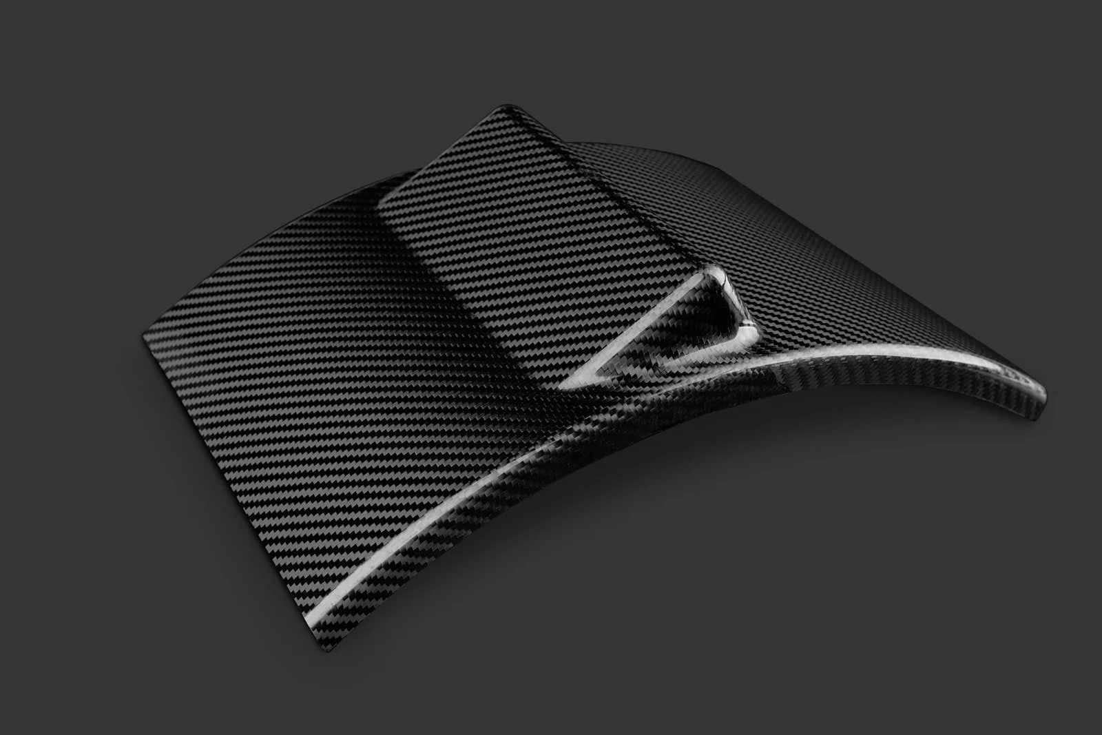 Carbon fiber wallet with a curved ergonomic design
