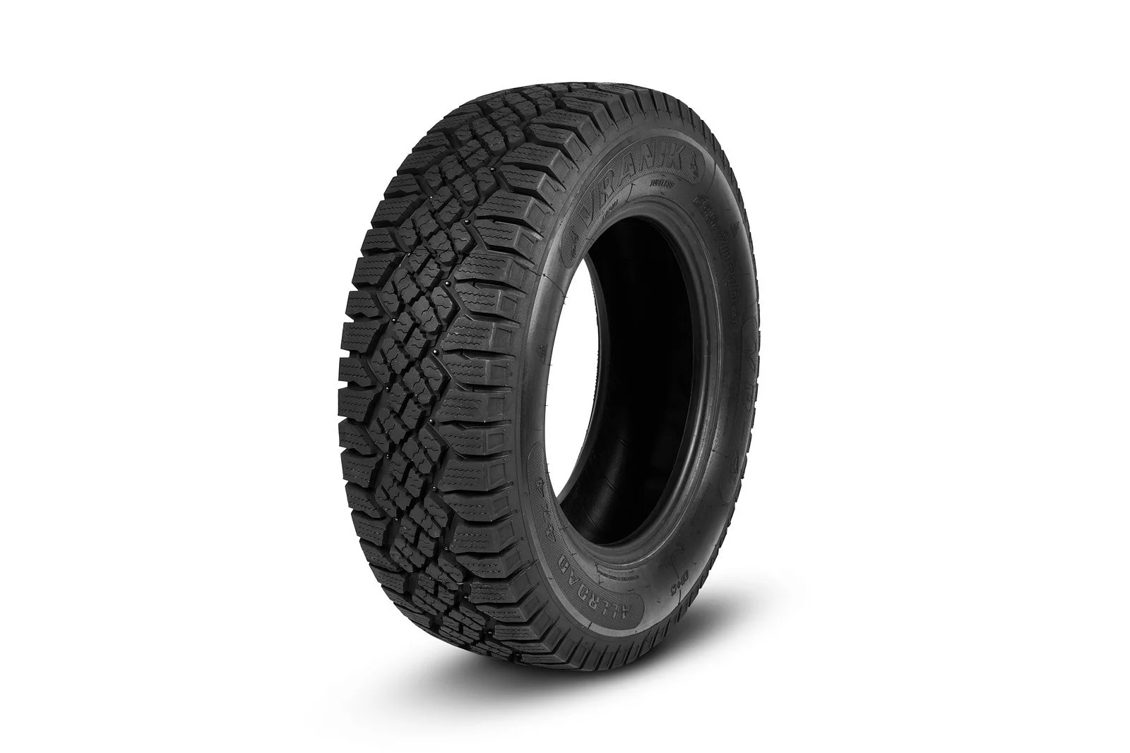 Black all-terrain tire with rugged tread pattern, isolated on white background.