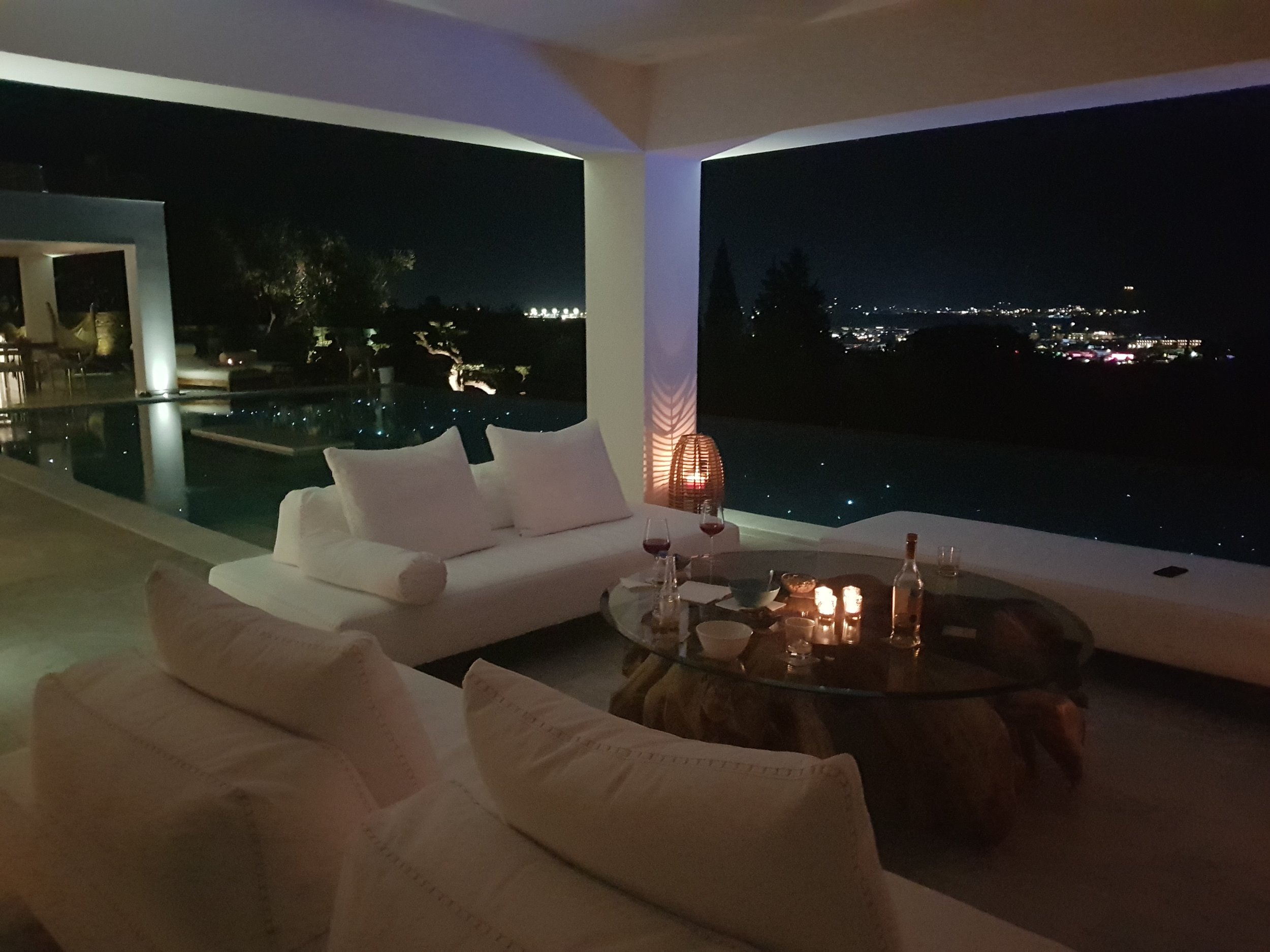 Private outdoor lounge and pool at a luxury villa in Zakynthos at night – Levante Villas