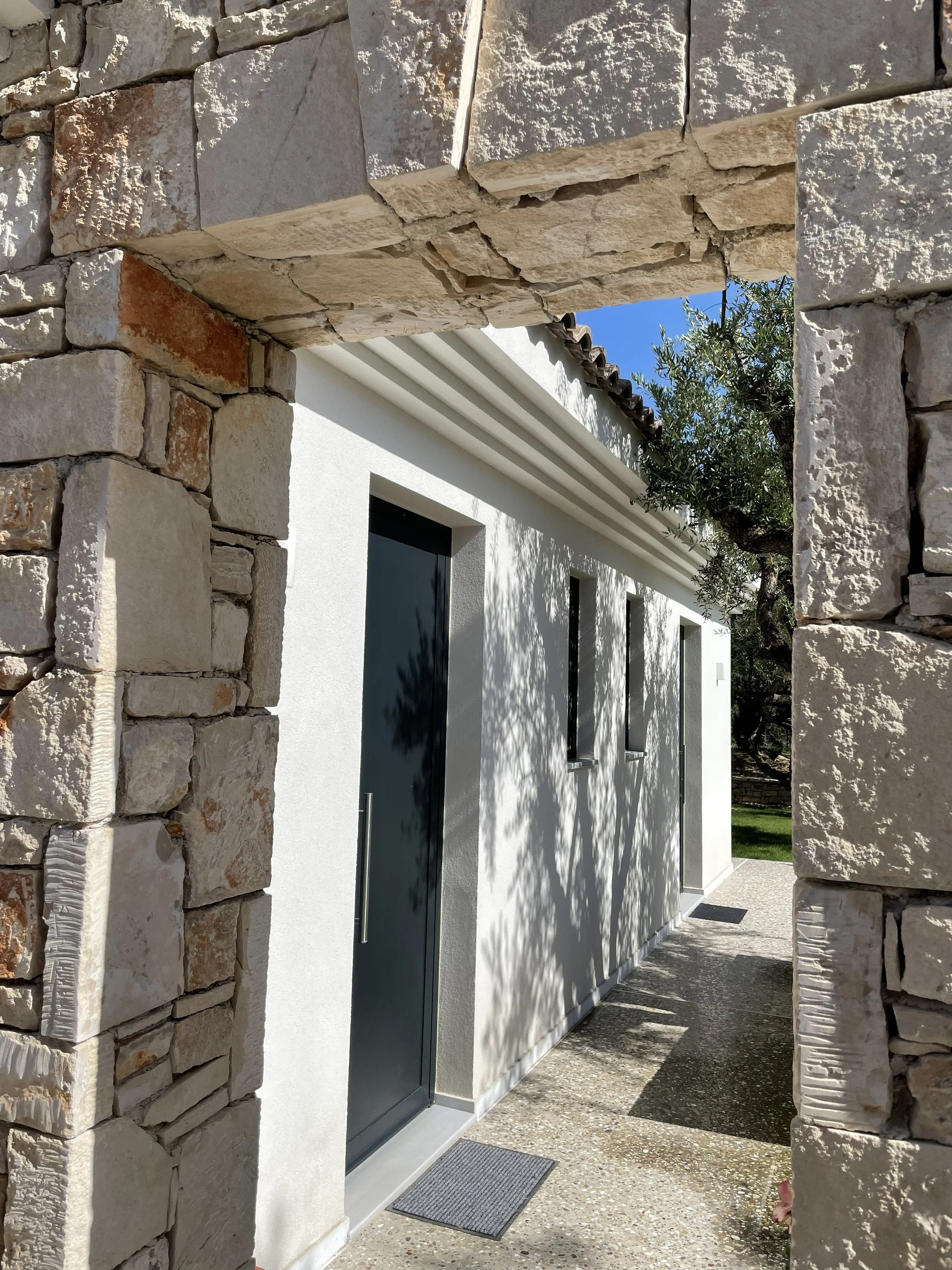 Private entrance of a luxury villa in Zakynthos surrounded by olive trees – Levante Villas