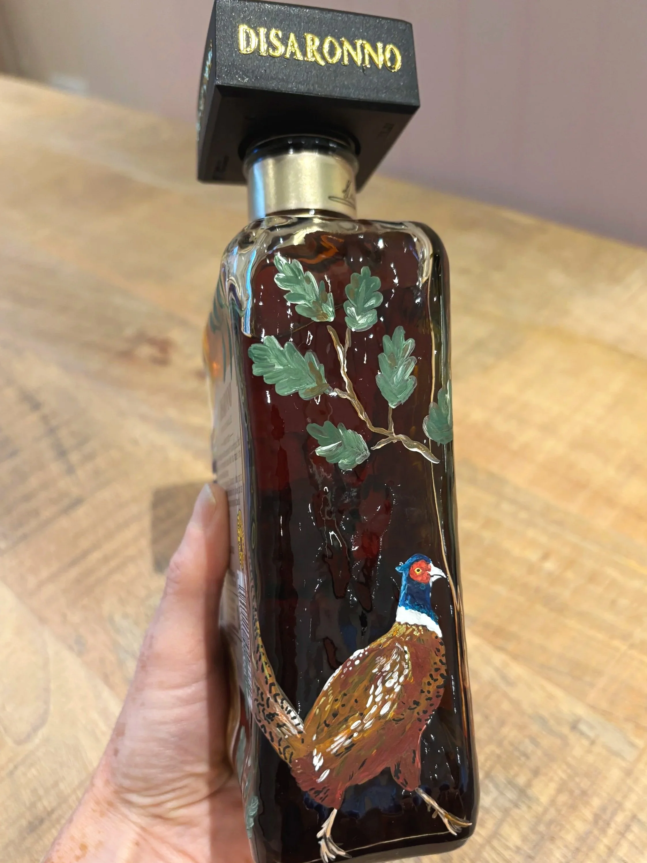 Hand Painted bottle of Disaronno with an English country theme with a pheasant and a stag. Best man gift. Wedding gift. By Minutes illustration.
