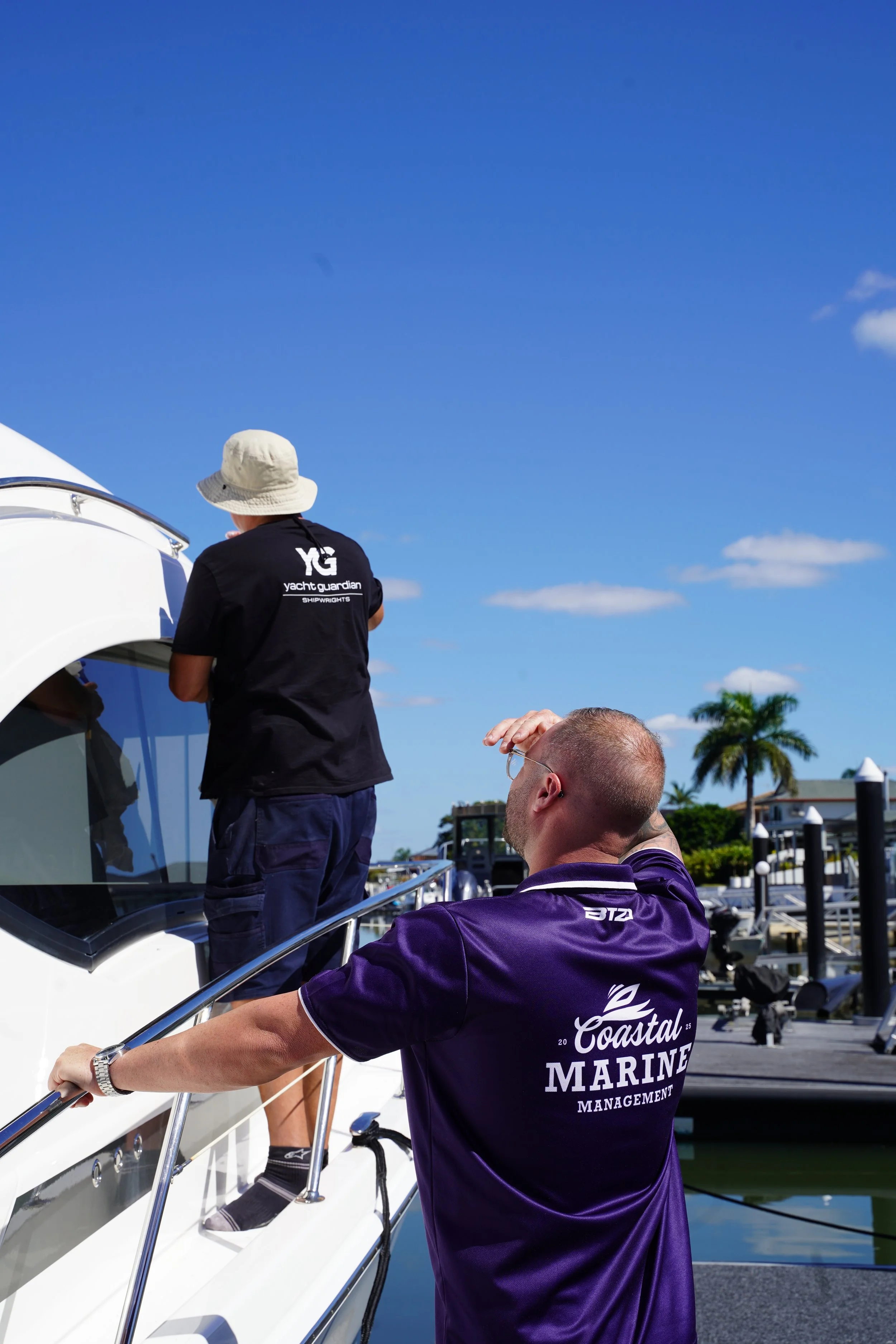 Coastal Marine Management team on a boat dock
