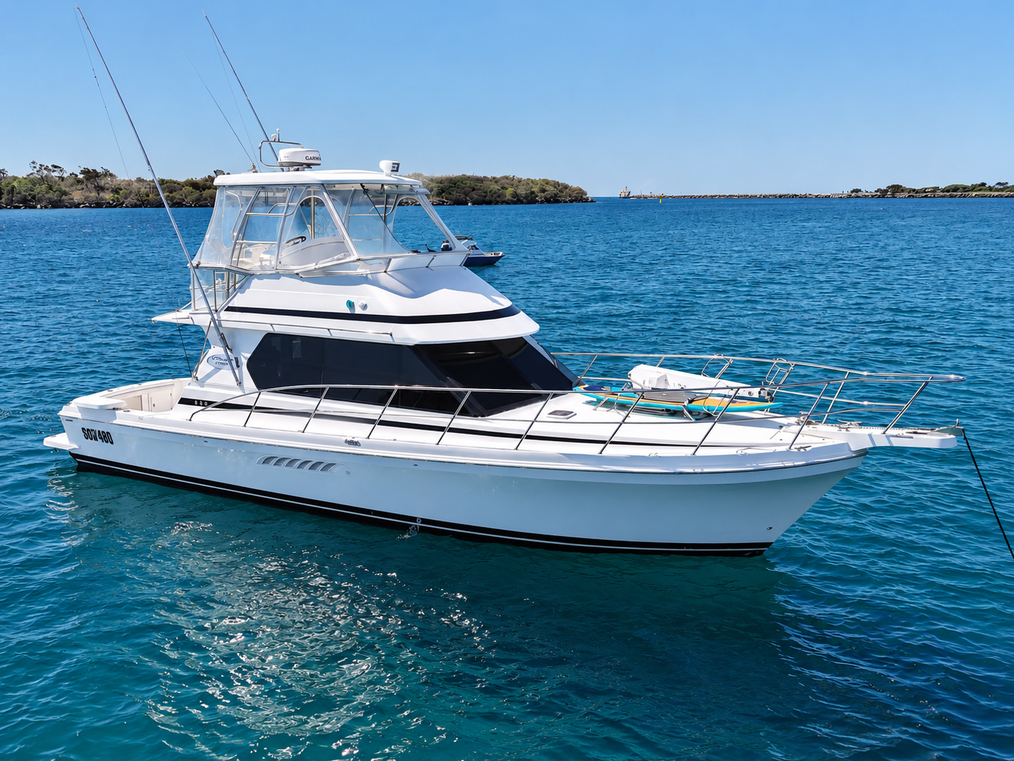 A white yacht with black accents