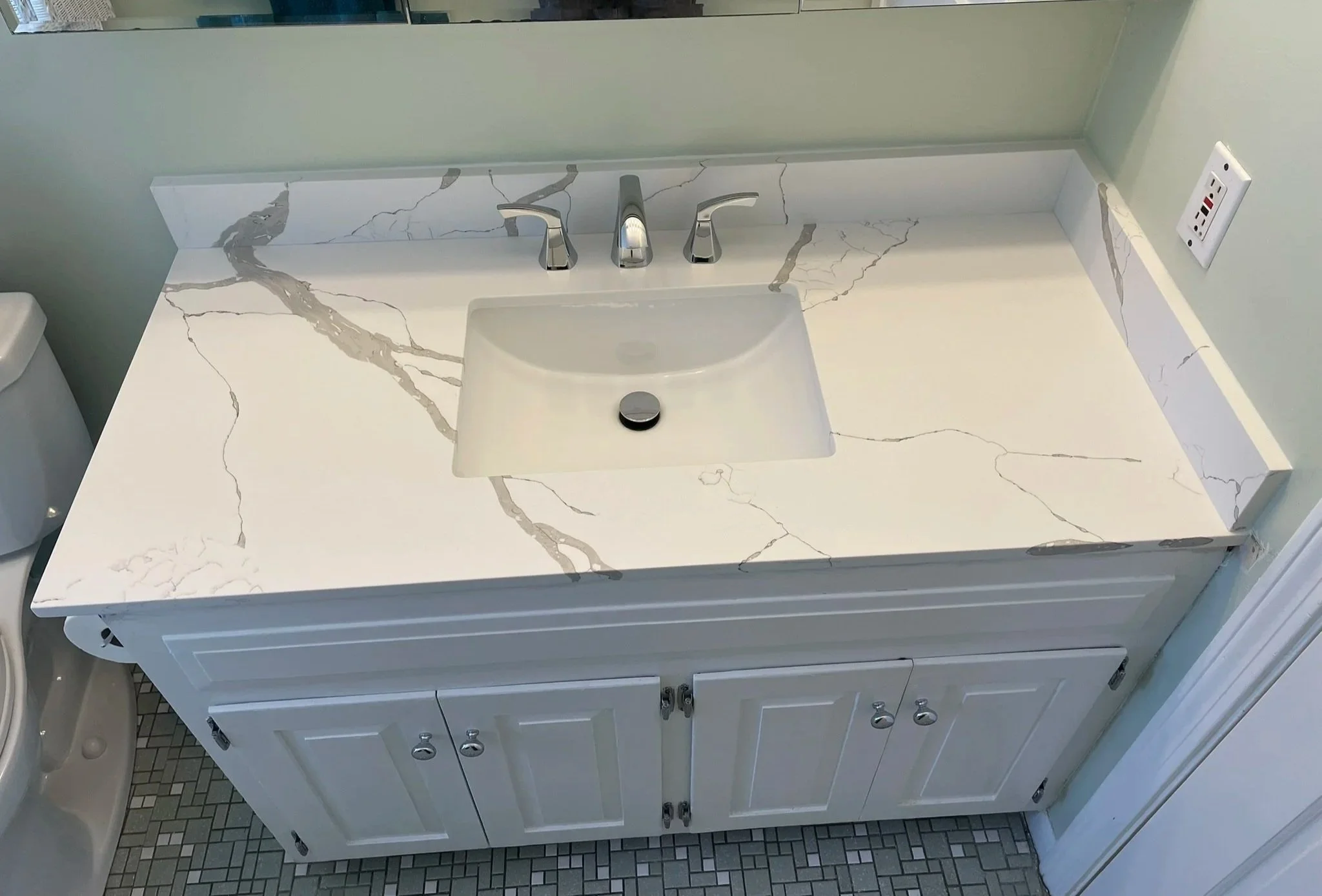 The magic of a new vanity top and fixtures. Sometimes, a picture is worth 1,000 words. See for yourself.